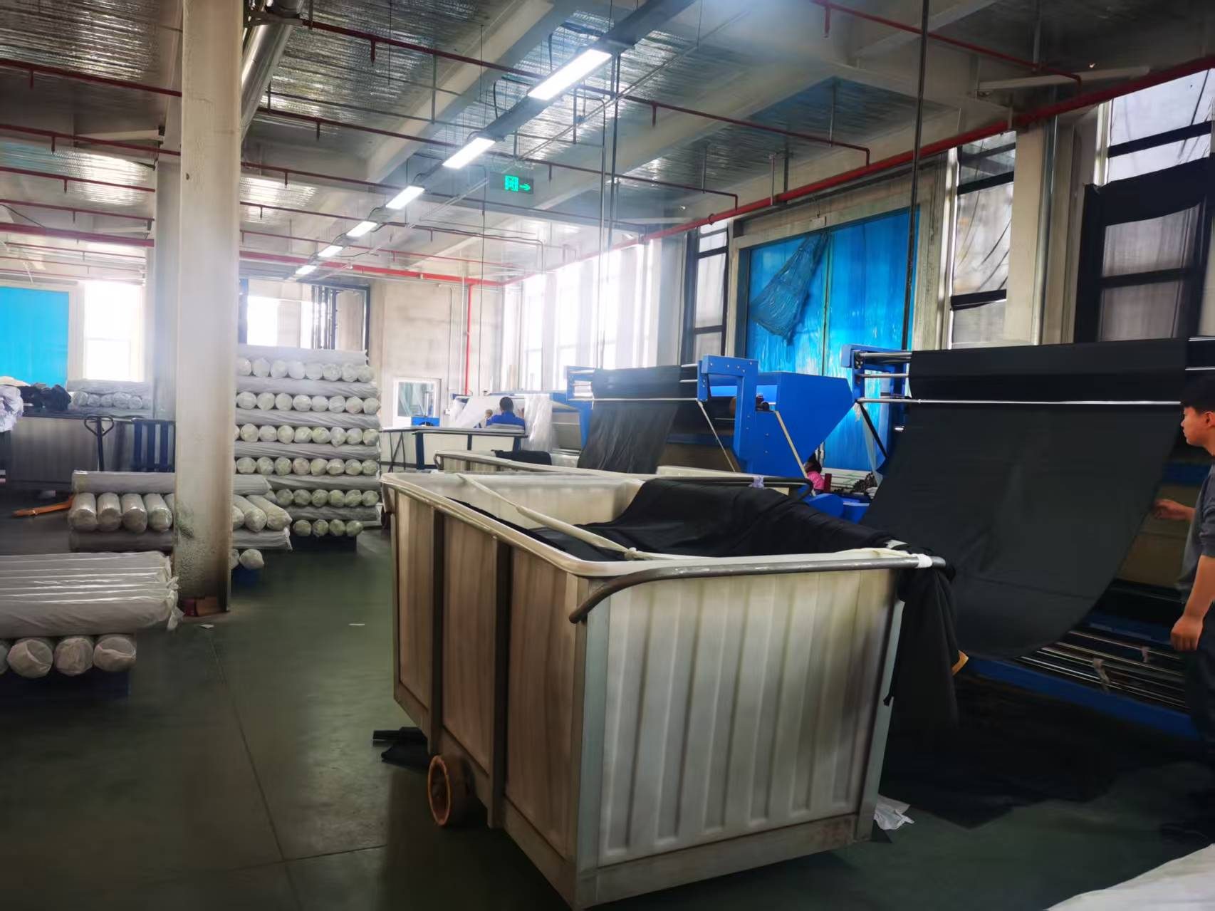 Packed fabric rolls on pallets
