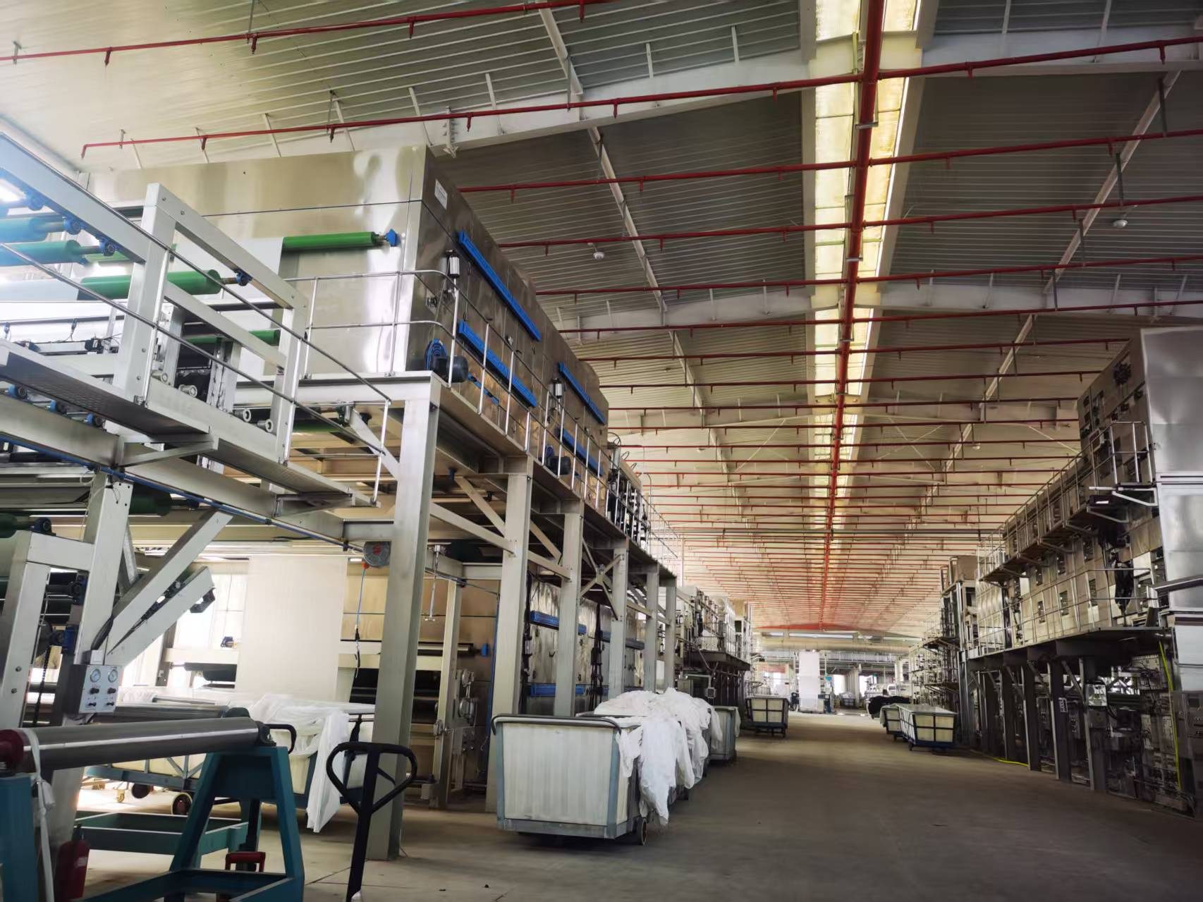 Greige PV fabric rolls in warehouse